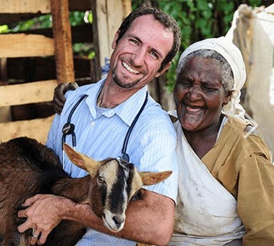 Veterinarian Helping a Woman with her Farm Animal