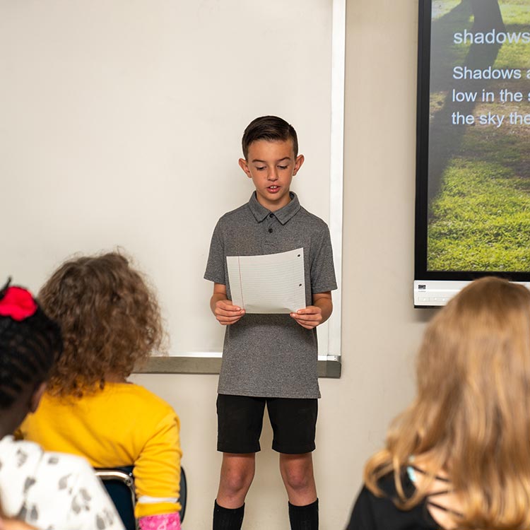 Cultivating Leaders: Boy Giving Presentation at School
